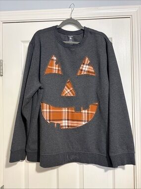 Hand made crewneck with pumpkin face cutout